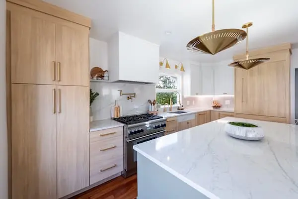 Modern kitchen with beige cabinet and white island countertop