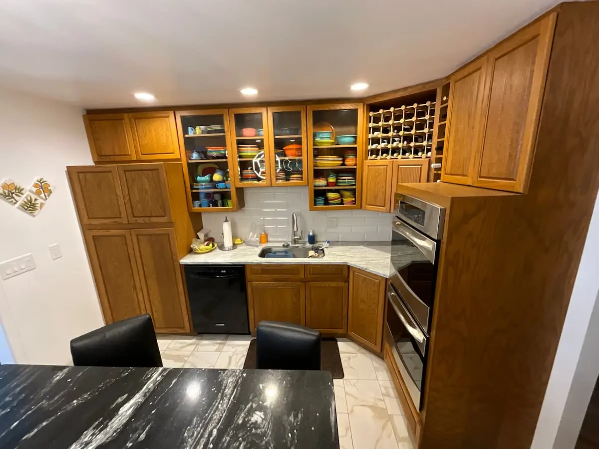 kitchen with outdated orange tone cabinets