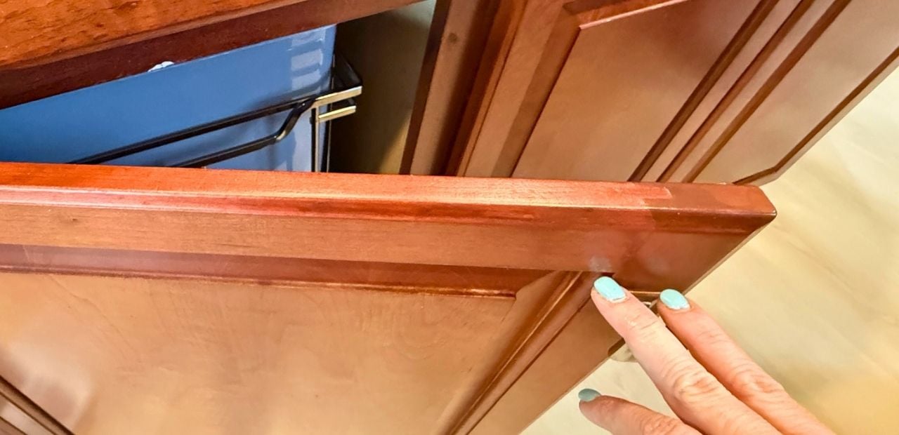 After: Same cherry door perfectly restored—smooth, scratch-free edge with rich uniform stain.