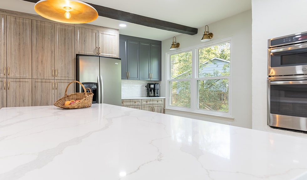 custom-rtf-cabinets-white-quartz-island-and-brass-hardware