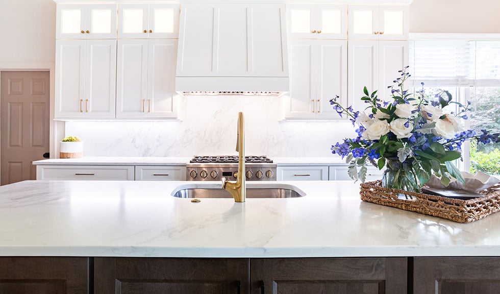 custom-kitchen-island-white-cabinets-gold-fixtures