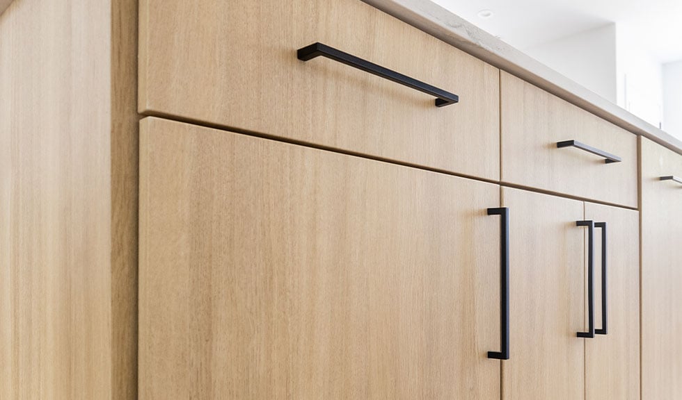 close-up-light-wood-rtf-cabinet-doors-modern-black-hardware