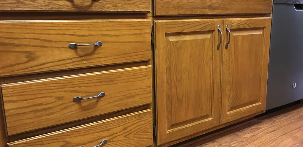 scratched kitchen cabinet before reconditioning